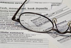 2396206-montly-financial-report-with-reading-glasses